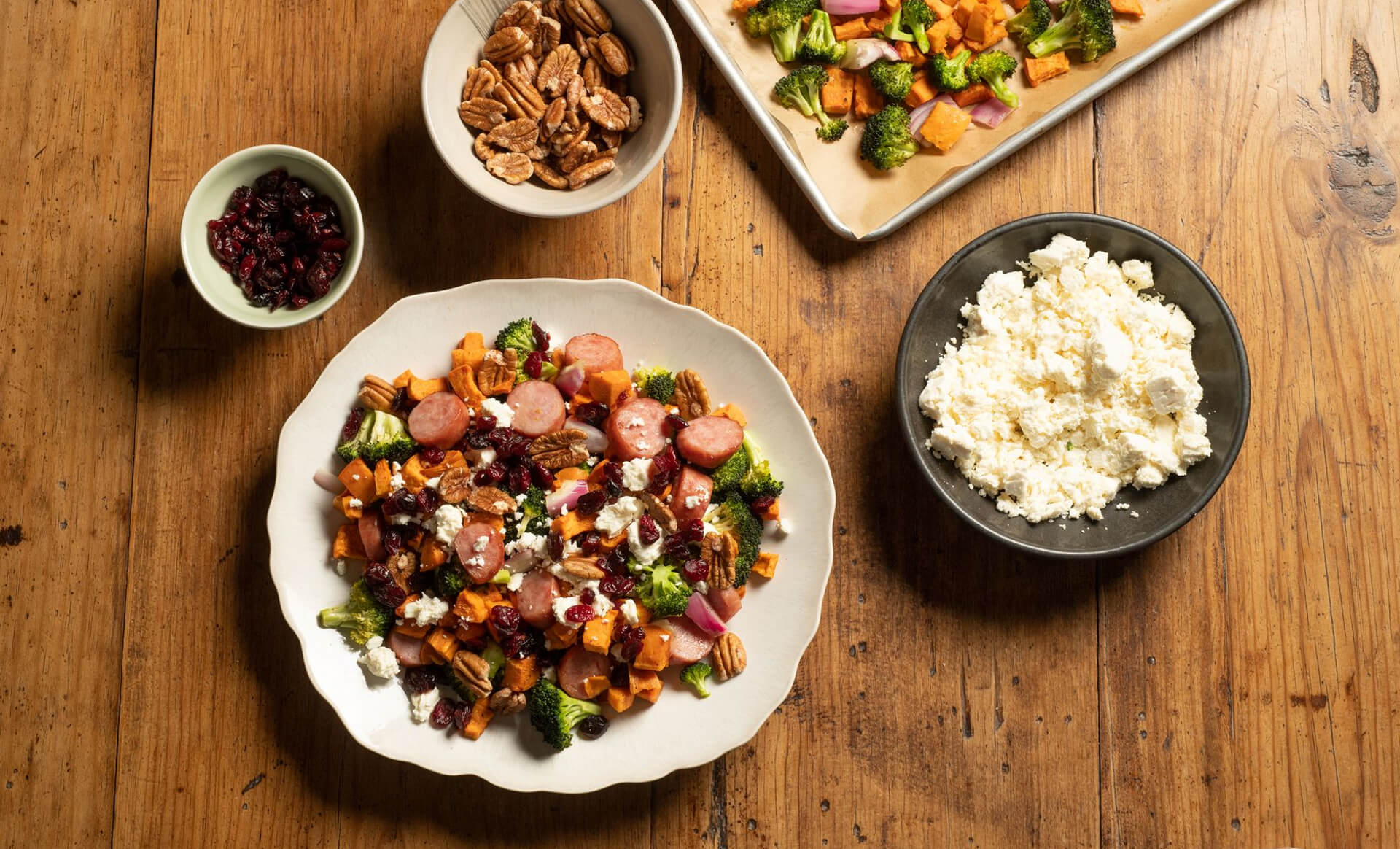 Kielbasa sheet pan dinner with dried cranberries and feta